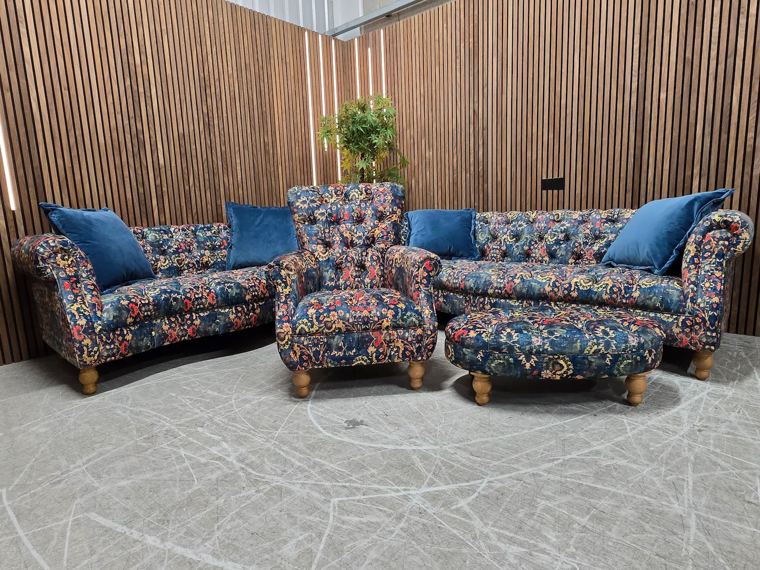 serpentine chesterfield 3 seater, 2 seater sofa, footstool and armchair in blue floral