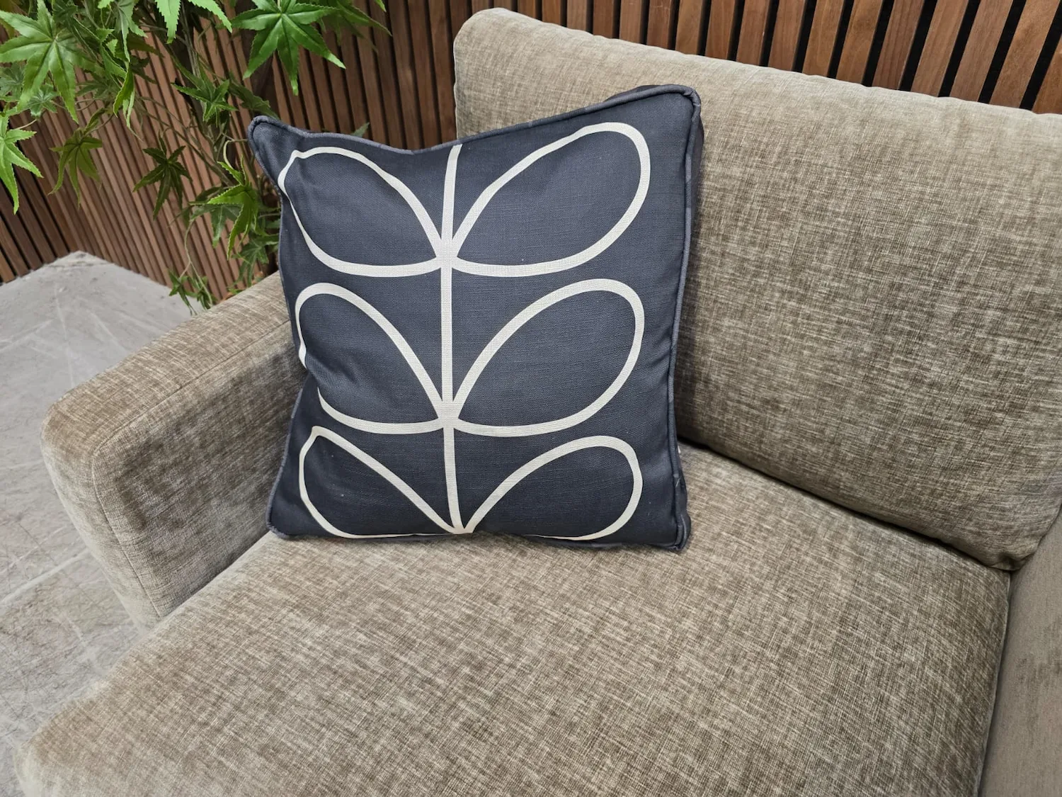 overhead zoomed in of black patterned cushion Orla kiely Larch chair