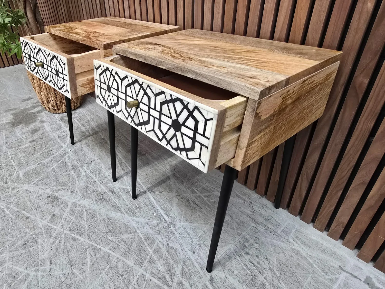 drawers open on the bedside tables