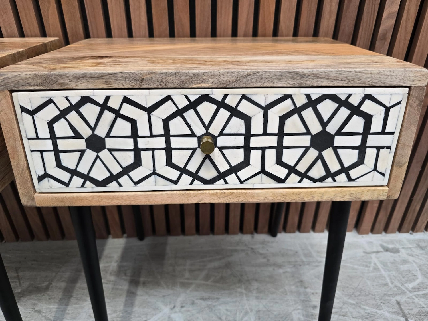 close up of the drawer fronts in white and a black abstract design