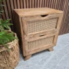 showcasing the mango wood and rattan design on the drawers from the left side