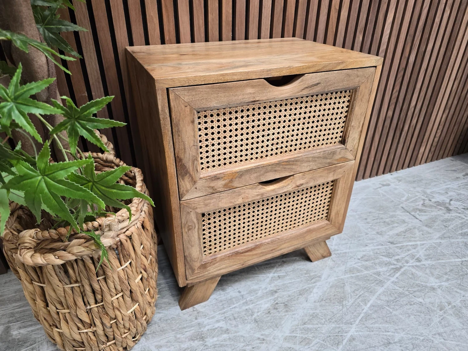 showcasing the mango wood and rattan design on the drawers from the left side