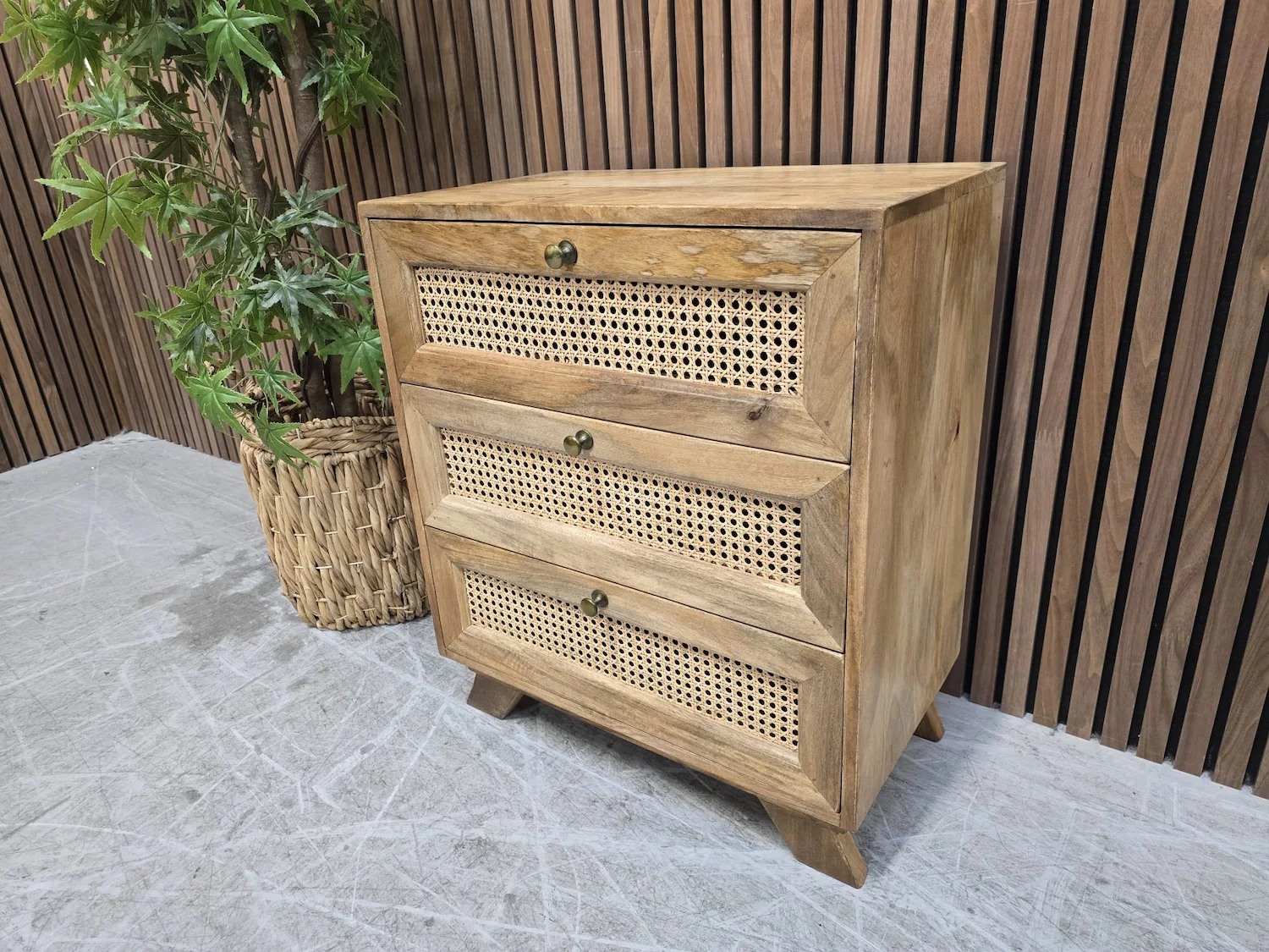 picture from the right of the mango wood and rattan 3 drawer bedside
