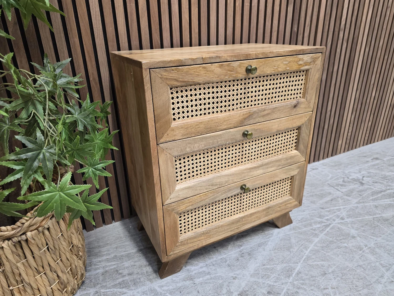 left side picture of the rustic mango 3 drawer bedside cabinet