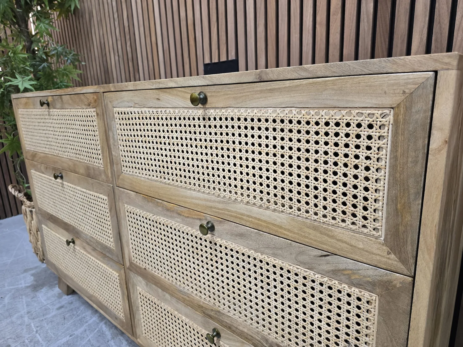 close up photo of rattan fronted drawers