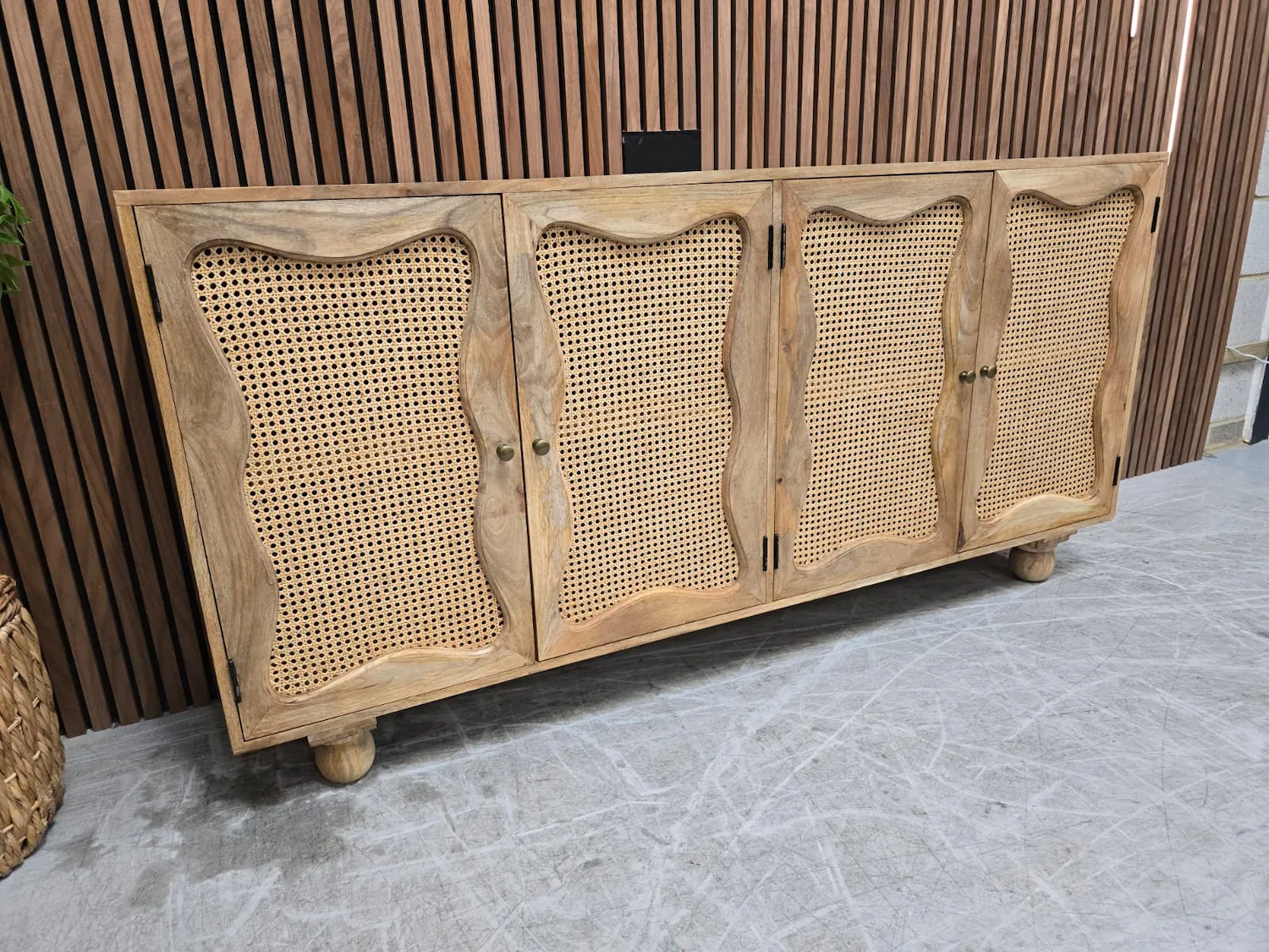 Boho Rattan Sideboard 3 rustic mango wooden and rattan sideboard from the left side
