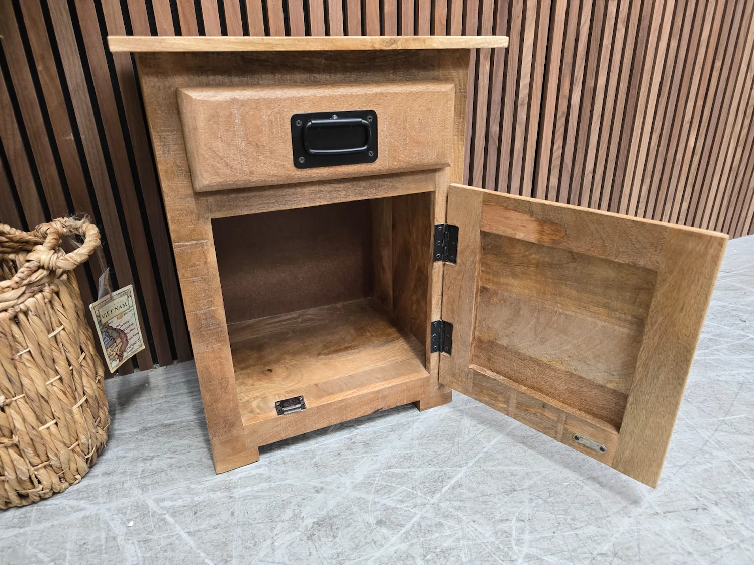 storage compartment open on the bottom of the side cabinet