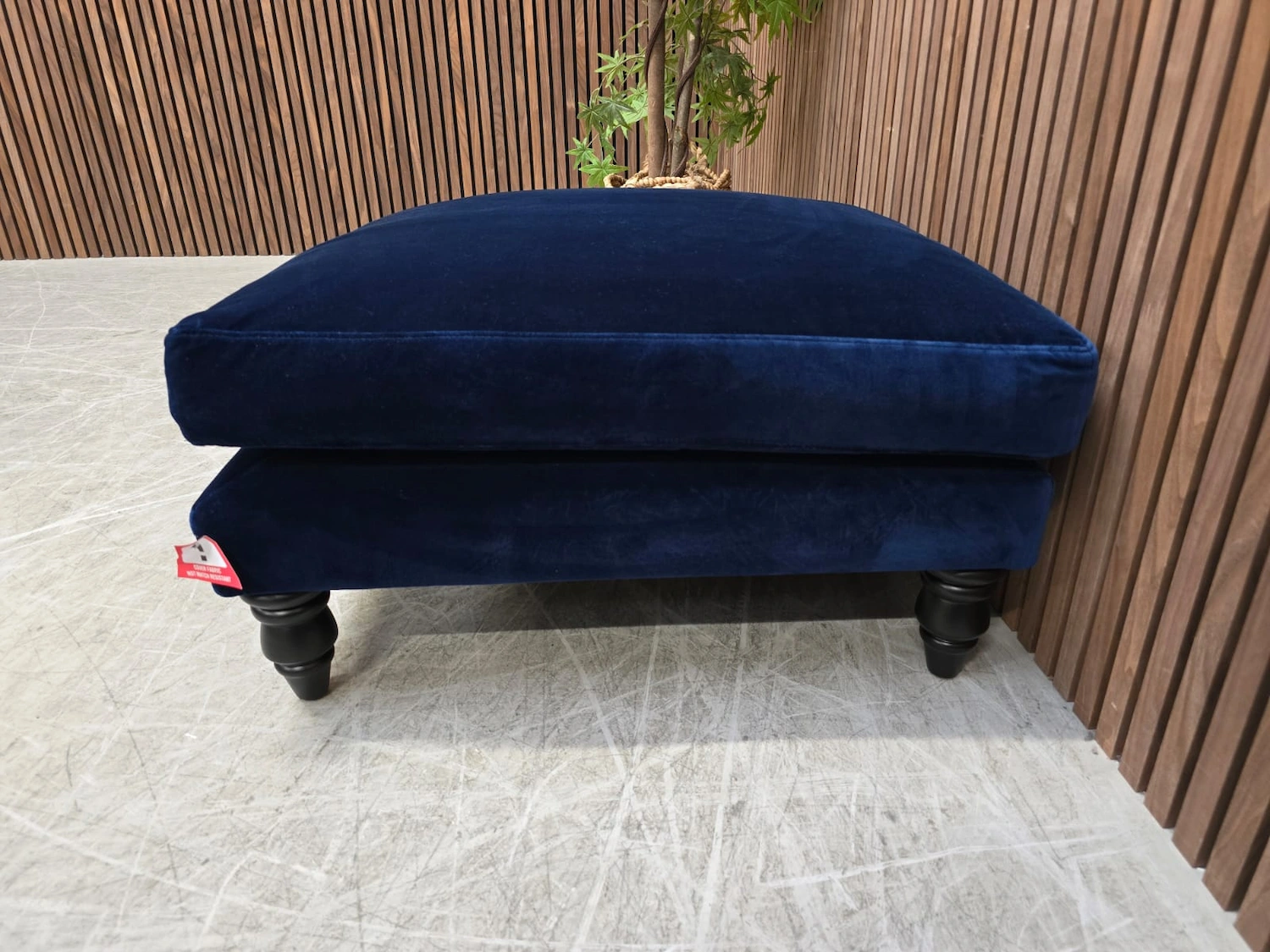 right side detail of the isla footstool in prussian