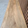 top of the tv stand showcasing the light mango wood grain