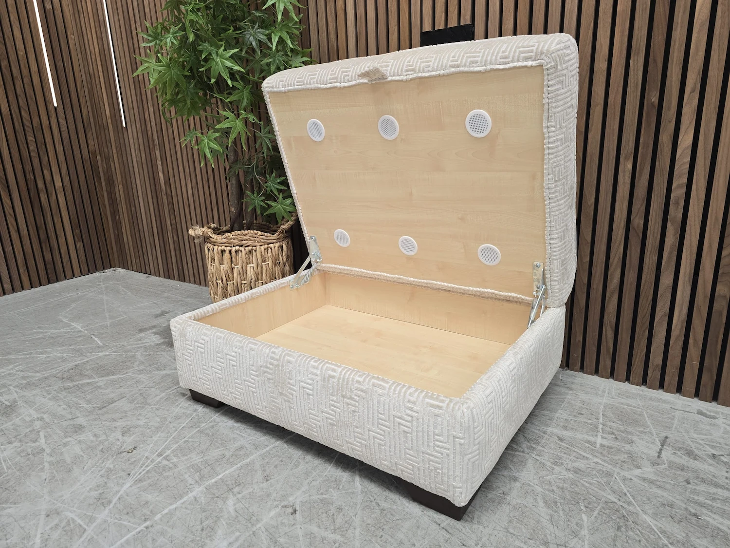 the large storage compartment with the lid of the footstool lifted