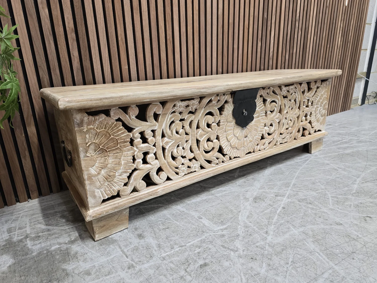 photo of the left side of the carved mango storage bench