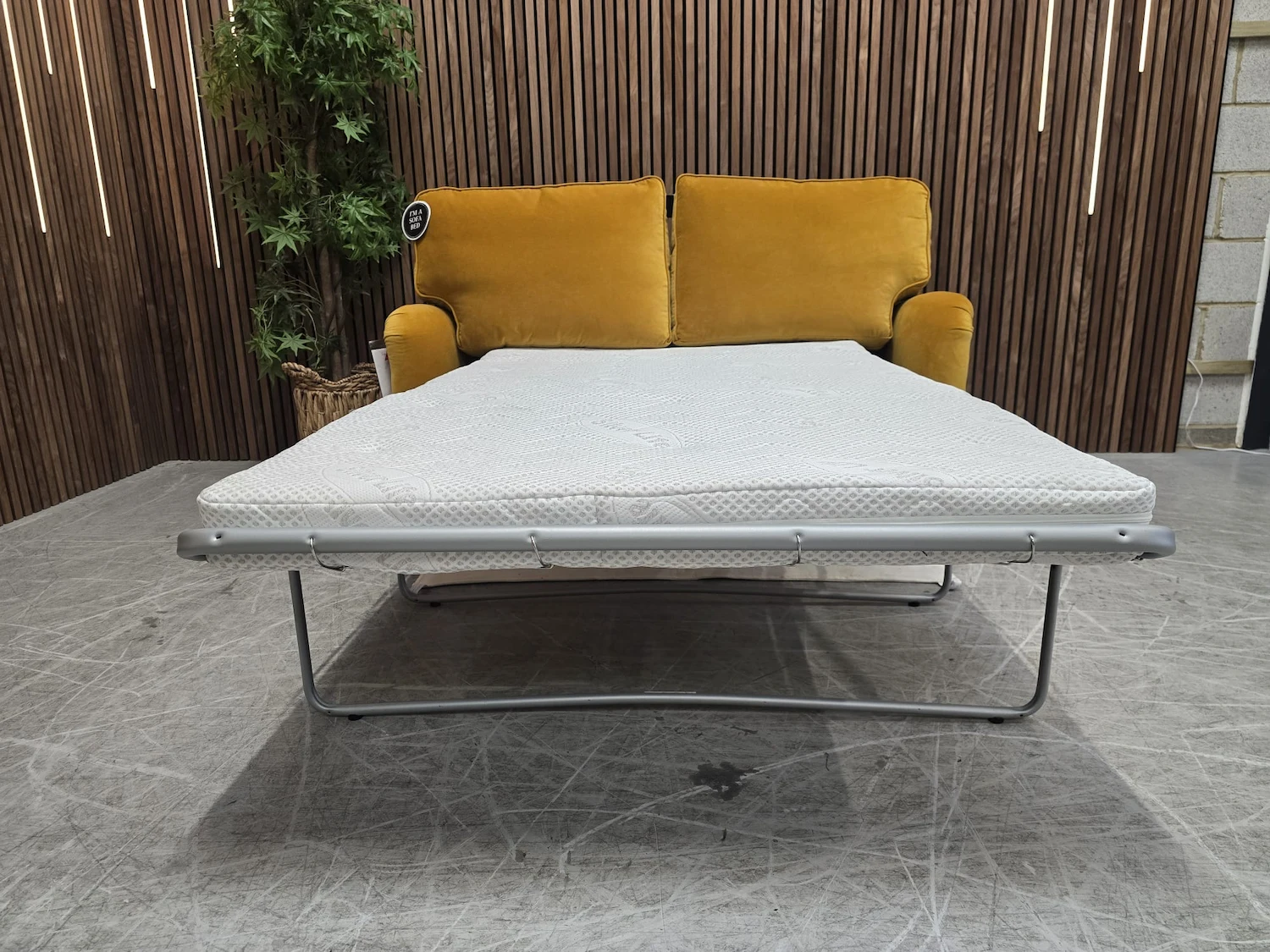 bluebell 2 seater sofa bed in amber smart velvet with the bed mechanism folded out