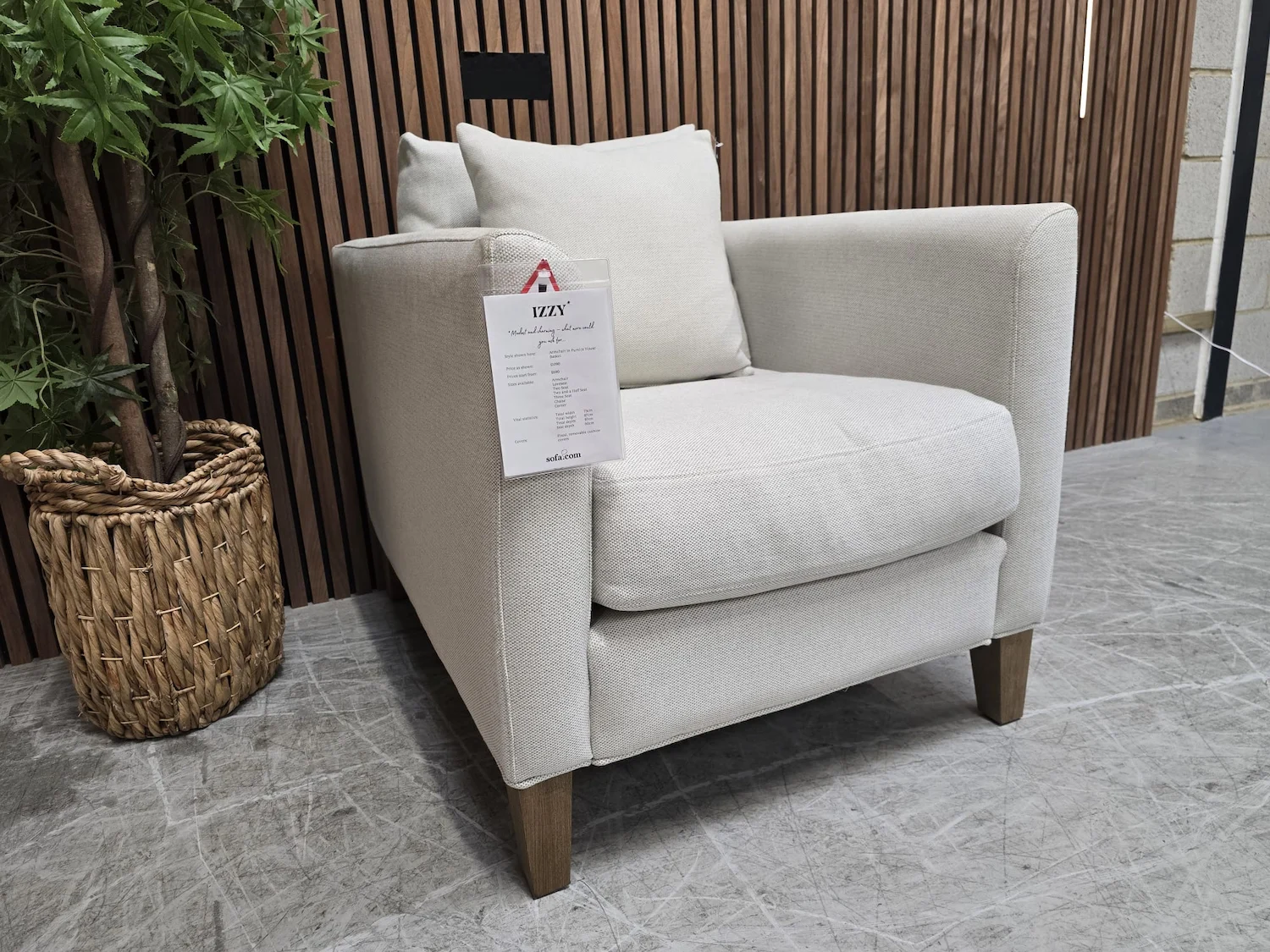 izzy armchair in pumice house basket weave from the left side