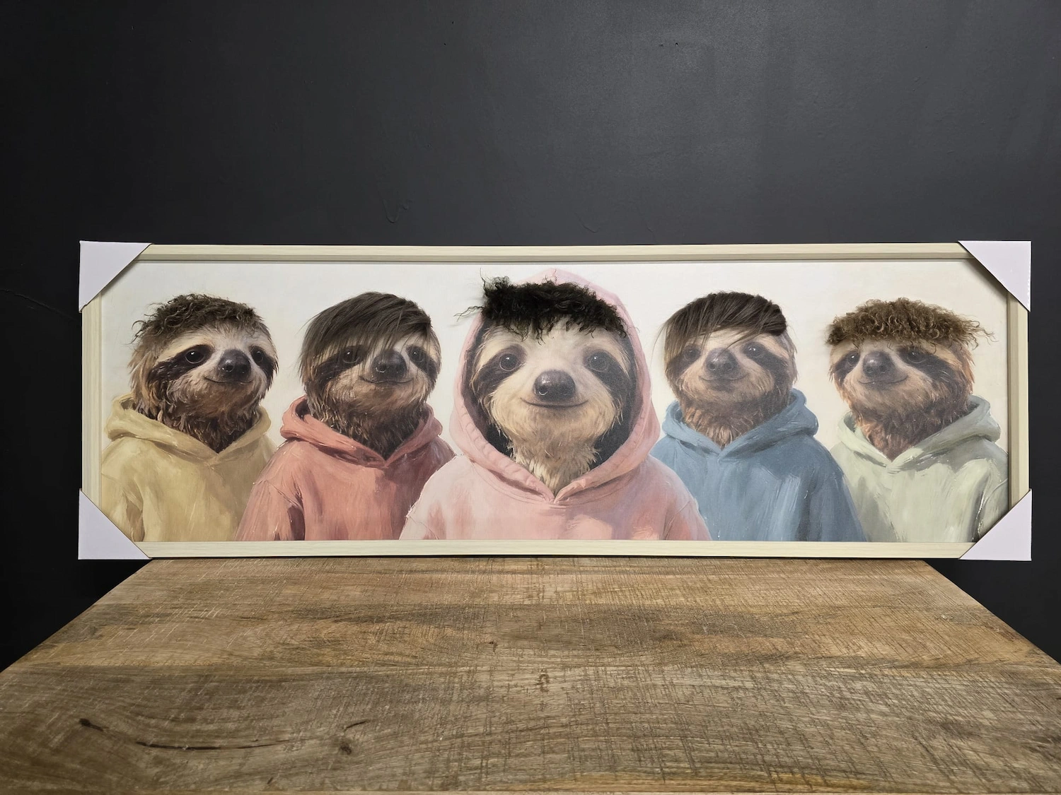 sloths in hoodies framed canvas wall art