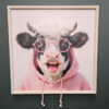 a picture of a cow in a hoodie and glasses laughing