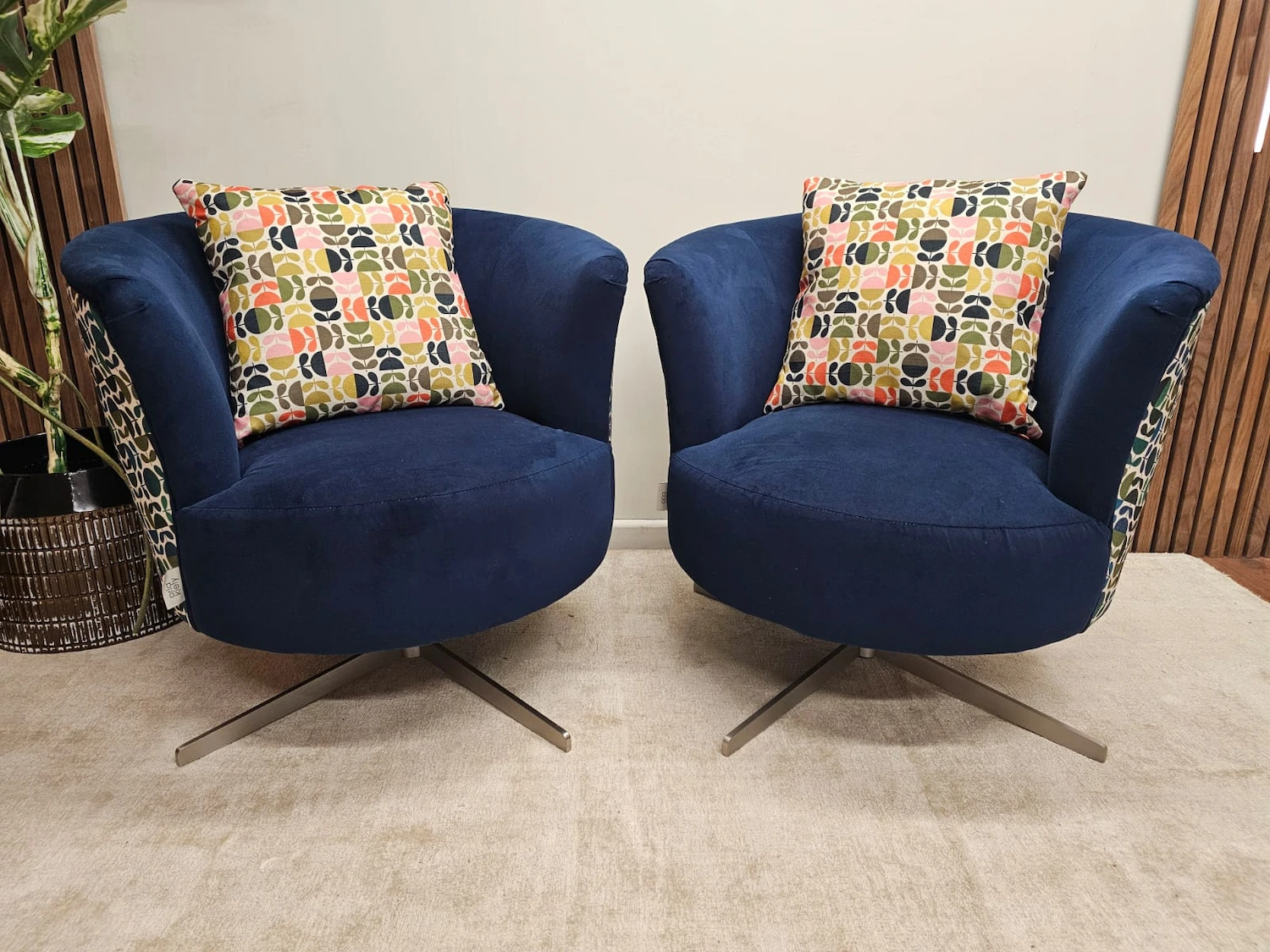 Pair Of Orla Kiely Lily Patterned Blue swivel chairs
